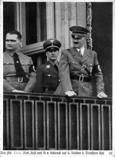 Adolf Hitler, Rudolf Hess and Baldur von Schirach watch the HJ parade through the streets of Nuremberg from the balcony of hotel Deutscher Hof
